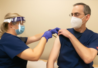 A nurse administers a vaccination 